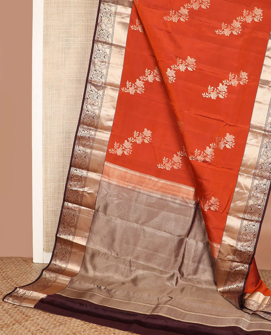 Orange floral buttas Vasundhara silk saree, contrast border of rekku, mayil kann, and mayil designs, and chevron striped pallu - Image 3
