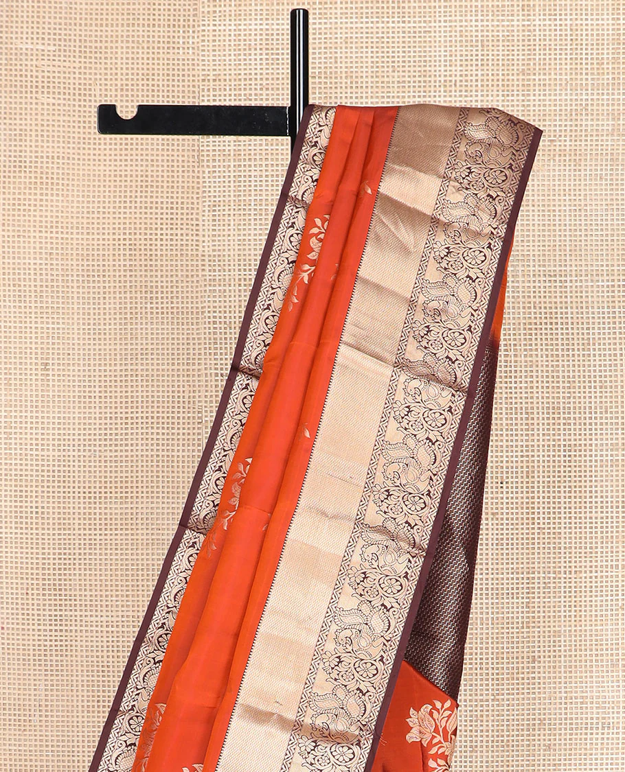 Orange floral buttas Vasundhara silk saree, contrast border of rekku, mayil kann, and mayil designs, and chevron striped pallu - Image 4