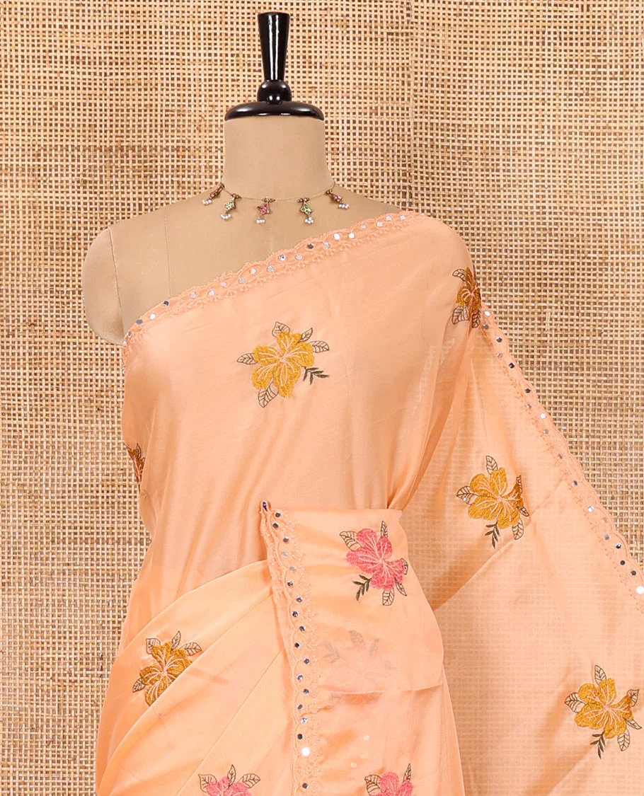 Orange floral motifs embroidered rangoli chiffon saree with mirror work border, embroidered pallu, and a contrast intricate scallop design embroidered blouse - Image 2