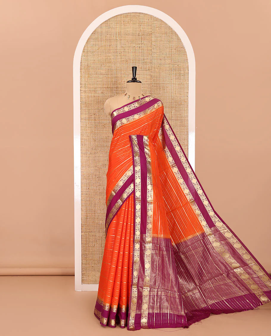 Orange gold zari design art crepe saree, contrast rettai pettu, peacock chakram zari border, zari-rich pallu, and a contrast zari design blouse