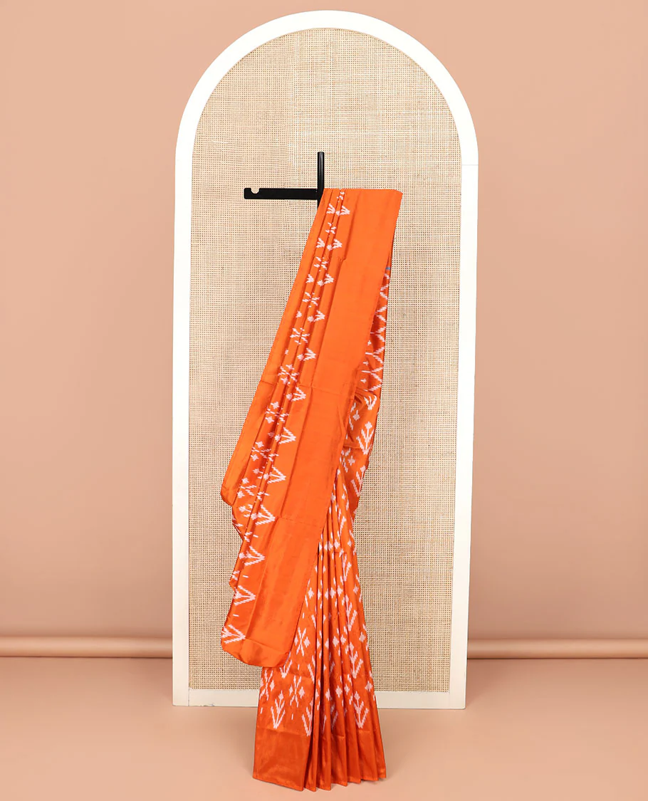 Orange Ikkat Silk Saree Decked with Ikkat Buttas, Featuring a Subtle Plain Border, Complemented by a Pallu Woven in an Ogee Pattern with Ikkat Texture - Image 2