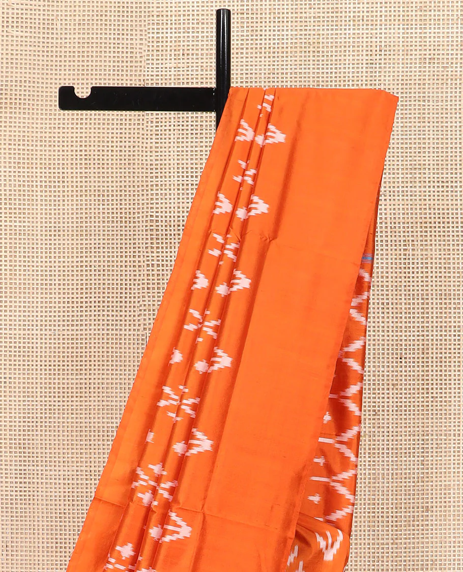 Orange Ikkat Silk Saree Decked with Ikkat Buttas, Featuring a Subtle Plain Border, Complemented by a Pallu Woven in an Ogee Pattern with Ikkat Texture - Image 3