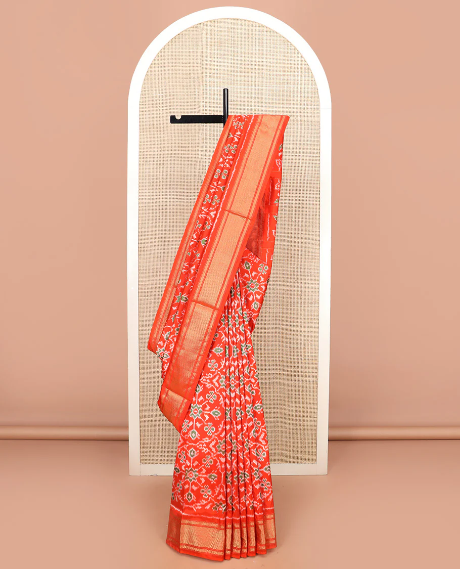 Orange Ikkat Silk Saree Hazily Woven in Ikkat Floral Design Across the Body, Featuring a Zari Border, Pallu of Ikkat Weave, and Paired with a Matching Blouse - Image 2