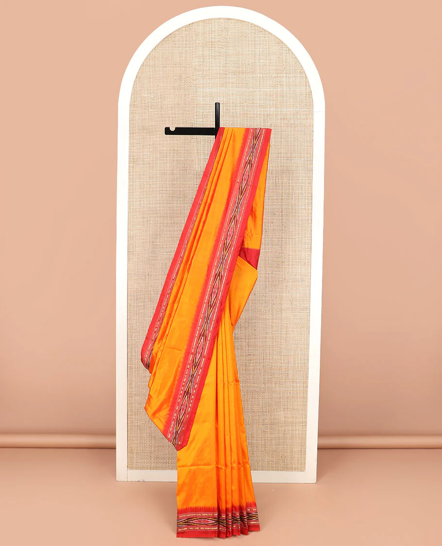 Orange Plain Ikkat Silk Saree with a Contrast Red Border Adorned by a Hazy Ikkat Weave, Featuring a Pallu Flanked by Stripes and Ikkat Texture - Image 2
