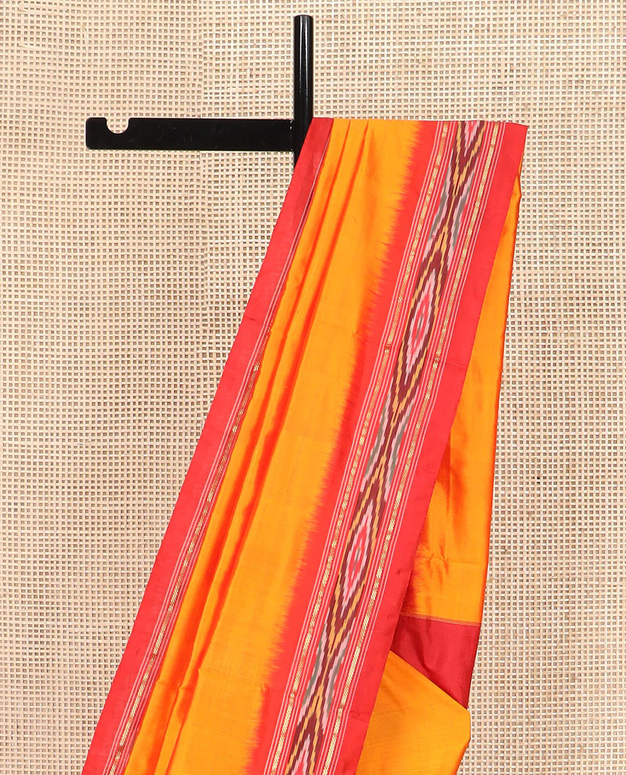 Orange Plain Ikkat Silk Saree with a Contrast Red Border Adorned by a Hazy Ikkat Weave, Featuring a Pallu Flanked by Stripes and Ikkat Texture - Image 3