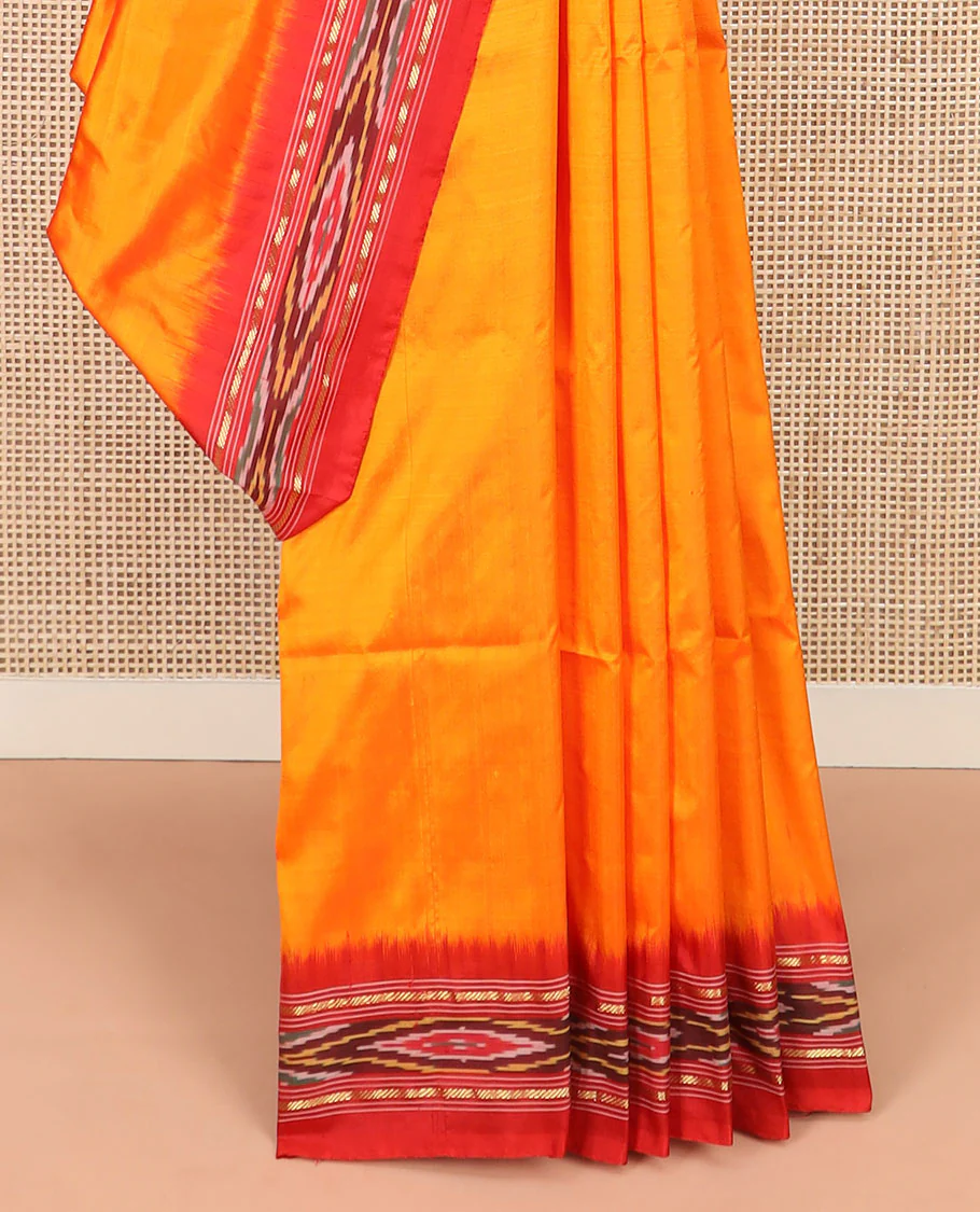 Orange Plain Ikkat Silk Saree with a Contrast Red Border Adorned by a Hazy Ikkat Weave, Featuring a Pallu Flanked by Stripes and Ikkat Texture - Image 4