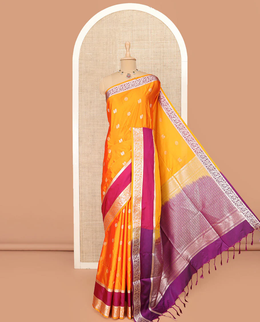 Orange Semi-Soft Silk Saree Featuring Peacock and Chakram Buttas, Complemented by a Contrast Rettai Pettu Traditional Zari Border of Peacocks, Grandly Woven Pallu of Jaal Designs, and Paired with a Contrast Blouse