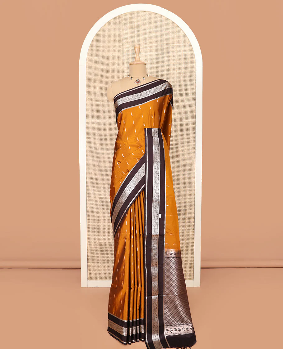 Orange Semi-Soft Silk Saree Graced with Zari Buttas Woven Across Its Body, Complemented by a Contrast Varisai Pettu Traditional Zari Border, Grandly Decked Up Pallu of Jaal Designs, and Paired with a Contrast Blouse - Image 3