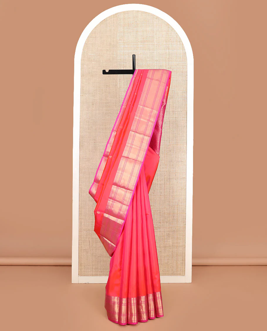Orange zari buttas Vasundhara silk saree, contrast border of thilakam, poun, mayil kann, and banaras designs, and jaal pallu