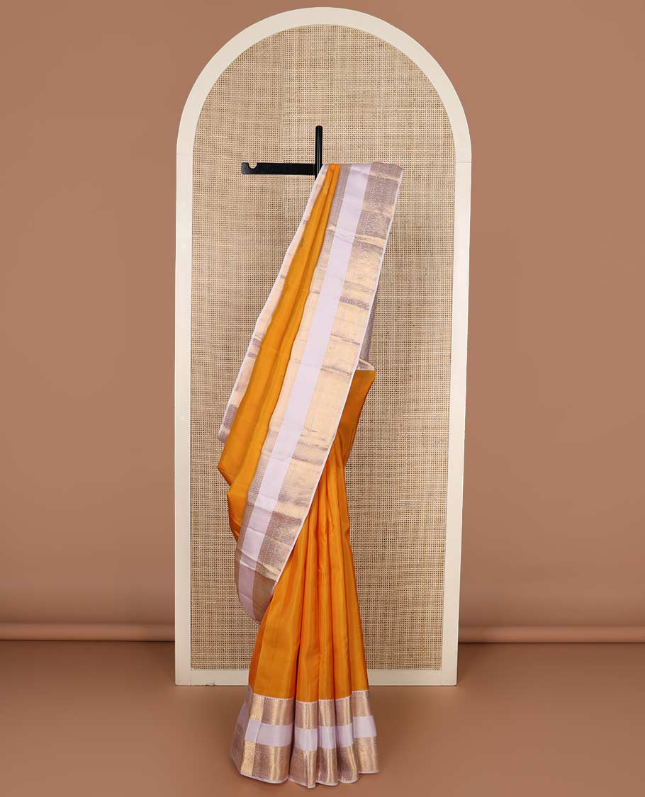 Orange zari buttas Vasundhara Lite Silk Mix Saree, contrast rettai pettu border of rekku, cross kamalam, and manga designs