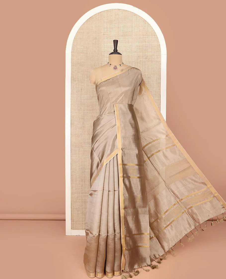 Pale Brown Plain Banana Pith Saree Subtly Sparkled with Zari Bavanji Border, Gleaming Zari Stripes Woven Pallu, and Paired with a Matching Plain Blouse