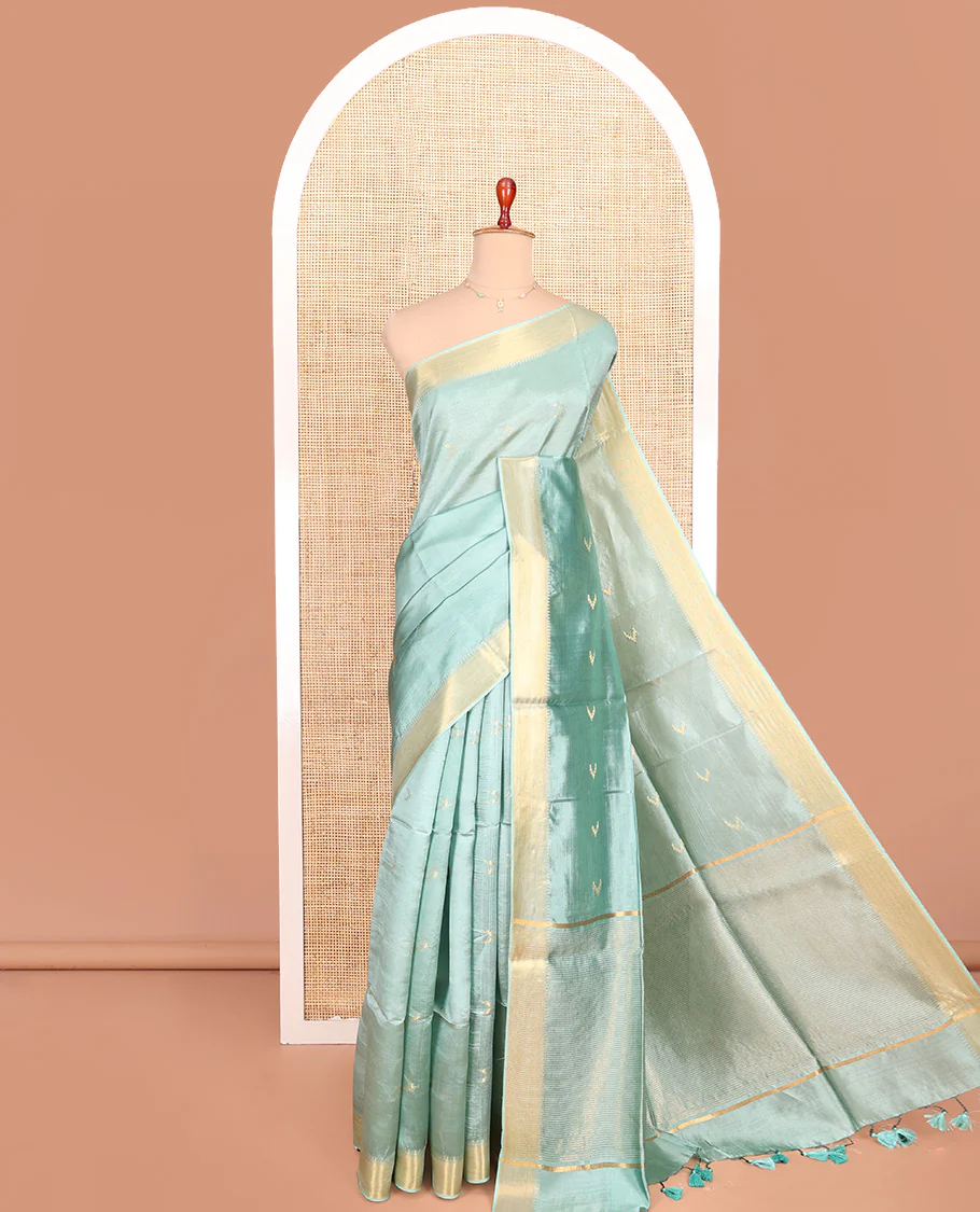 Pale Green Banana Pith Saree Decorated with Zari Temple Buttas, Delicately Woven Temple Zari Border, Gleaming Zari Pallu of Horizontal Stripes in Zari, and Paired with a Matching Plain Blouse
