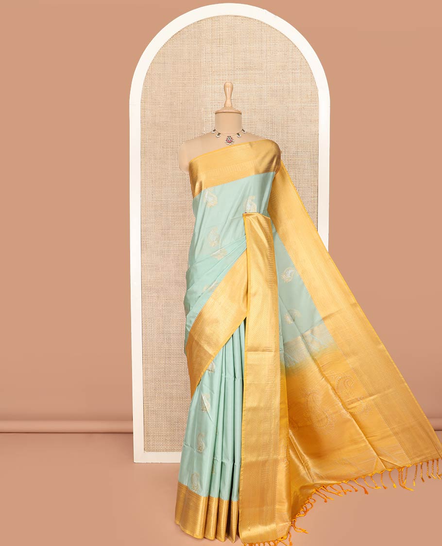 Pale Green Semi-Soft Silk Saree Featuring Paisley Buttas, Complemented by Contrast Traditional Zari Border, Gracefully Embellished Pallu of Paisley Designs, and Paired with a Contrast Blouse