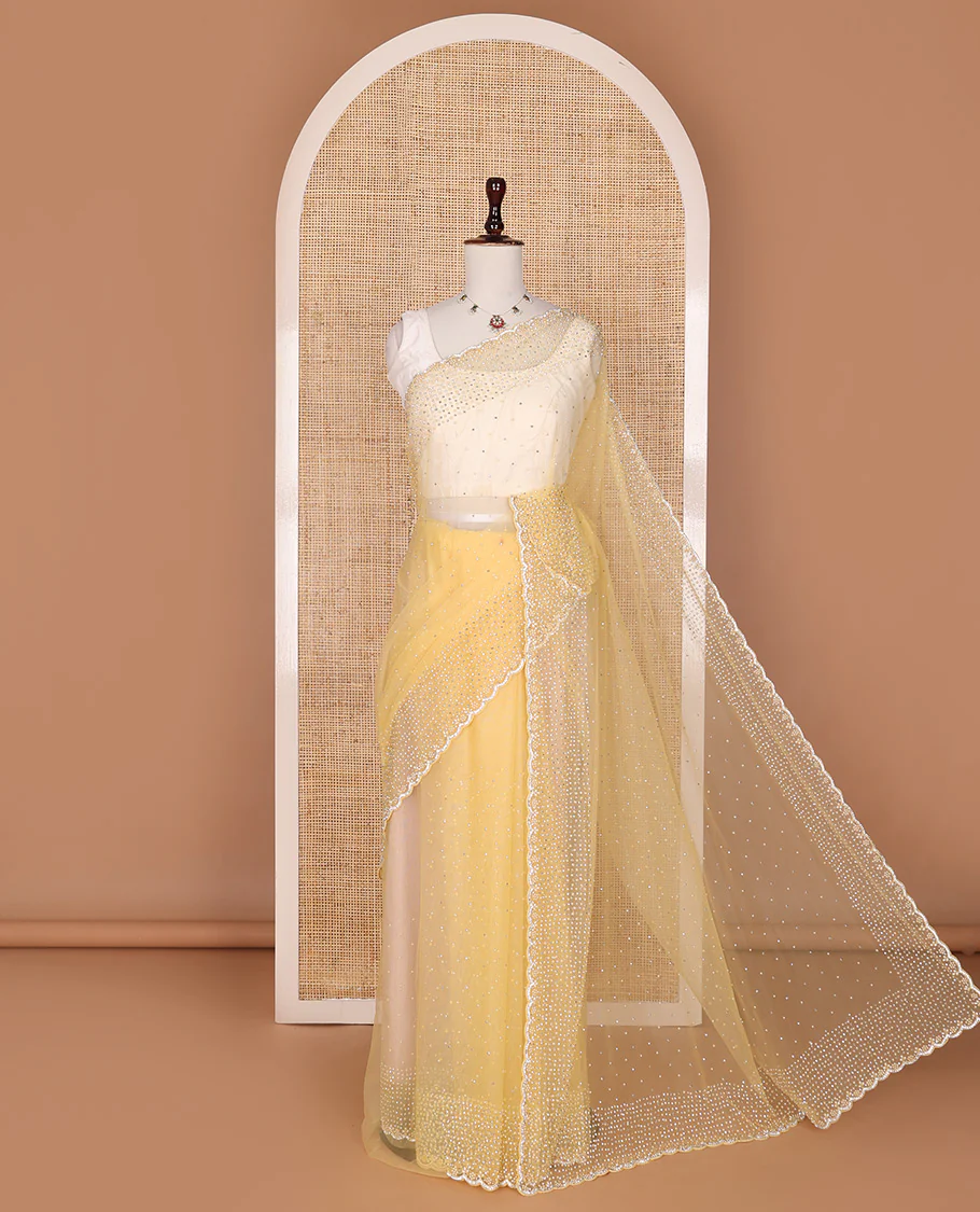 Pale yellow crystal stone & pearl beads embroidered designer saree with scallop embroidered border
