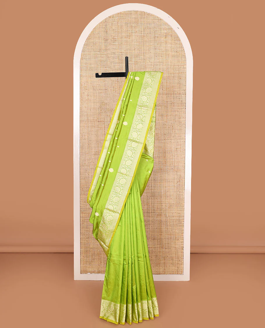 Parrot green buttas banarasi kathan silk saree,  floral creeper  border, and pallu of paisley jaal design
