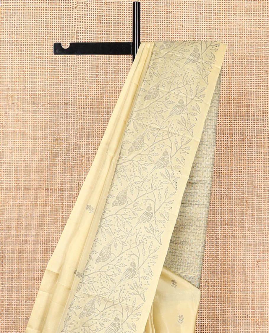Pastel yellow floral buttas Mayuri soft silk saree, floral-bird design border, and intricately designed pallu - Image 3