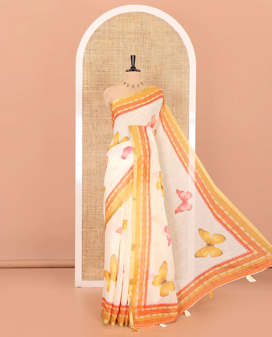 Peach and mustard color butterfly motifs printed linen-cotton saree with contrast geometric-printed border and a printed blouse
