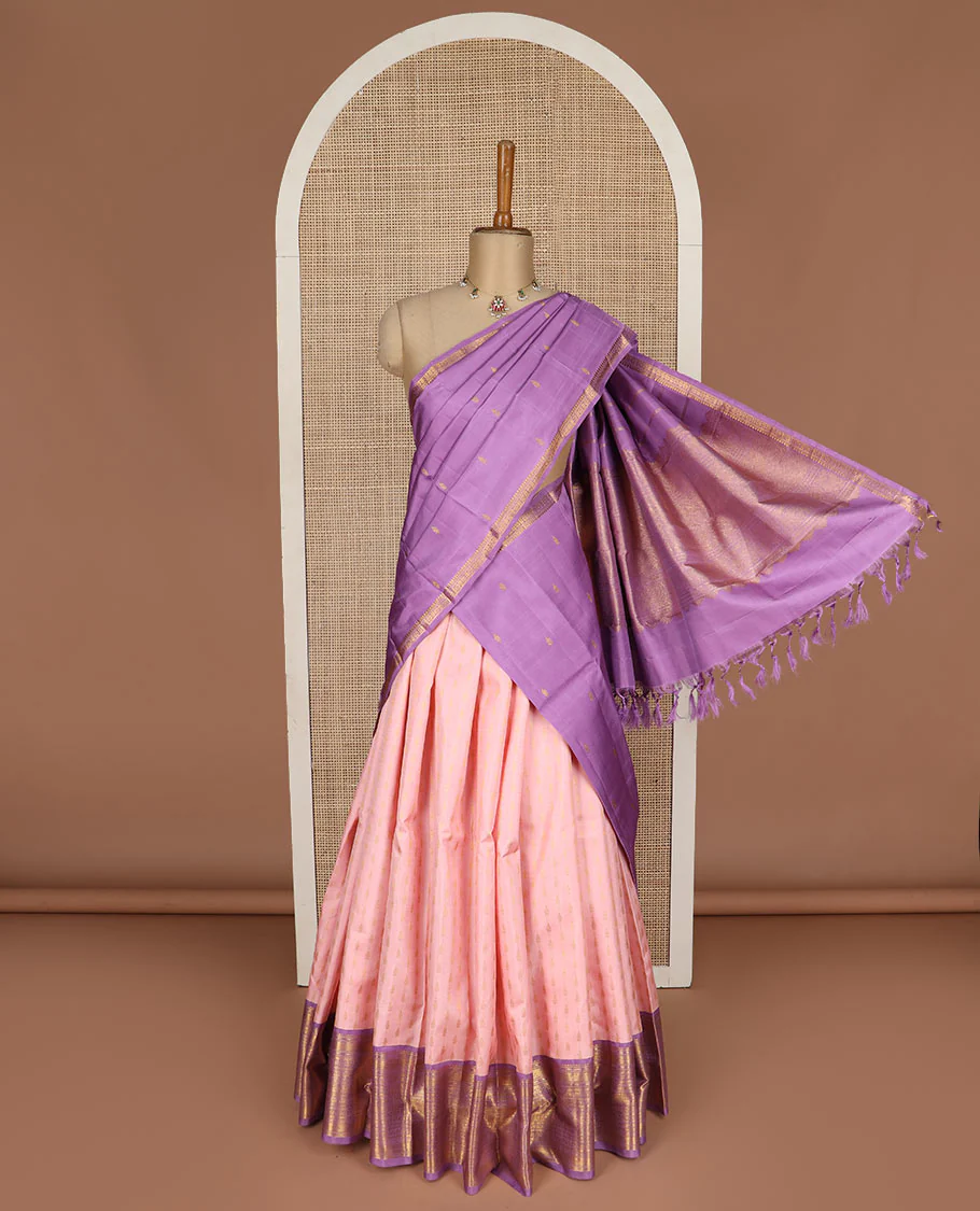 Peach puresilk halfsaree, zari buttas skirt, contrast border, blouse of rekku,banaras,muthu,mayil kann,rettai neli,poun,kathir,rudraksham, and kodi visiry, and zari woven dhavani
