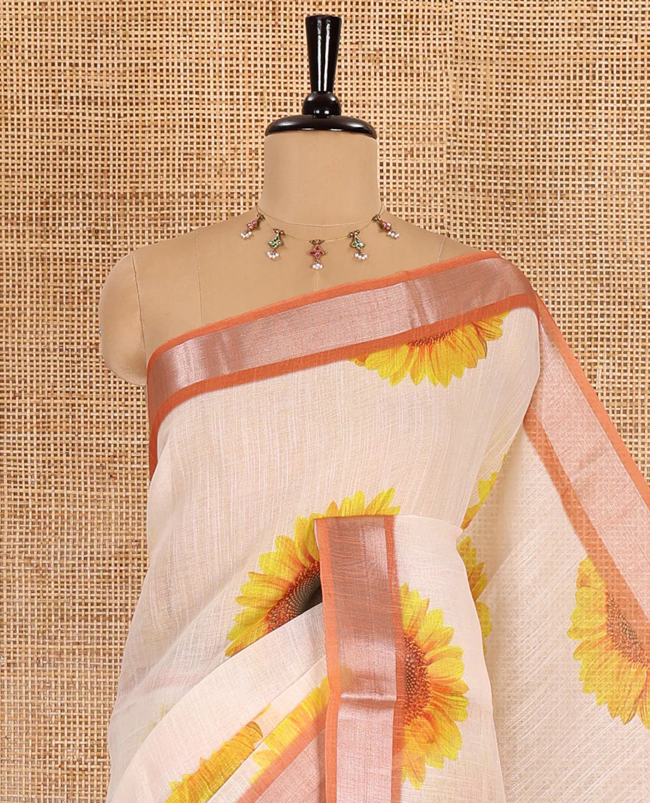 Peach sunflower motifs printed linen cotton saree, contrast zari border, sunflower motifs printed pallu, and contrast temple printed blouse - Image 2
