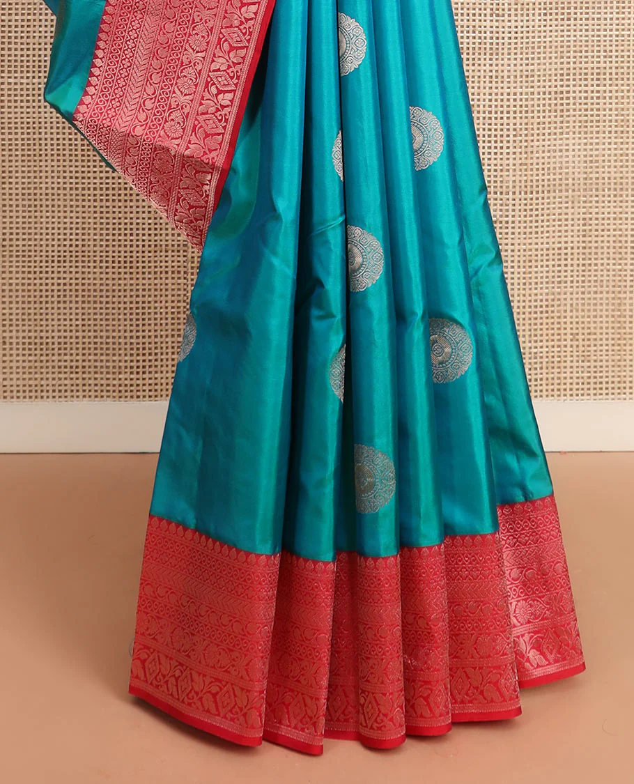 Peacock blue charkam buttas Vasundhara silk saree, contrast border of thilakam mokku, neli, kamalam, kathir, floral, and diamond designs, and Mughal floral woven pallu - Image 4