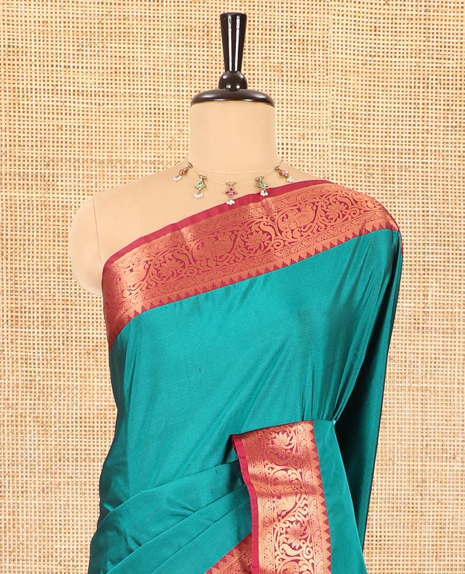 Peacock green plain luxury soft silk saree, contrast traditional temple zari border of elephant motifs, geometric zari pallu, and a contrast jacquard blouse - Image 3