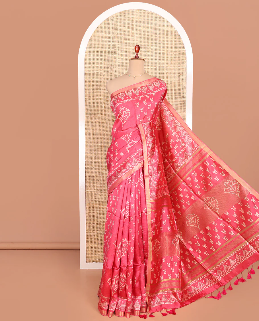 Pink Banana Pith Saree Elegantly Printed with Batik-Style Geometric Patterns Printed All Over Its Body, Subtly Woven Zari Piping Border, Printed Pallu, and Paired with a Batik Printed Matching Blouse