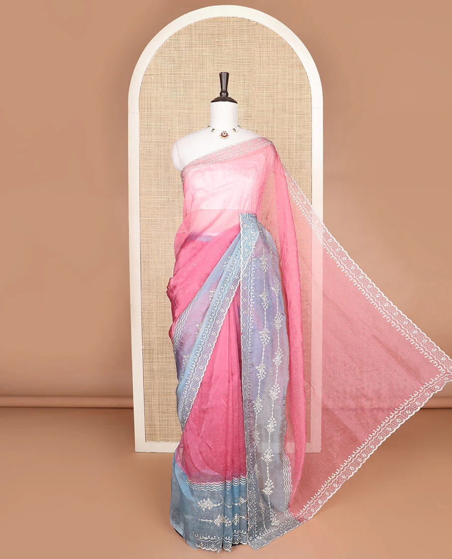 Pink embroidered designer saree with stones embedded in its body, contrast scallop stone work border