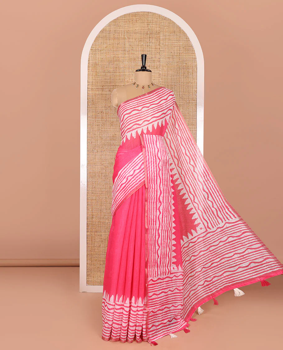 Pink plain linen cotton saree, temple zig-zag striped batik printed border, batik printed pallu, and triangle motifs batik printed blouse