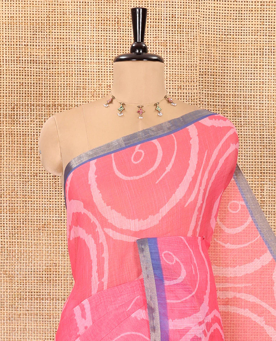 Pink spiral batik printed linen cotton saree, contrast piping border, floral printed pallu, and a contrast floral printed blouse - Image 2