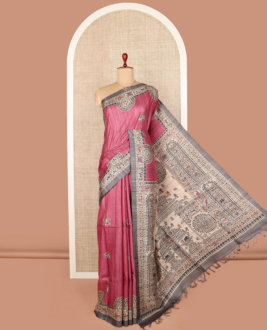 Pink warli printed tussar saree, contrast warli printed border, and pallu of warli motifs print