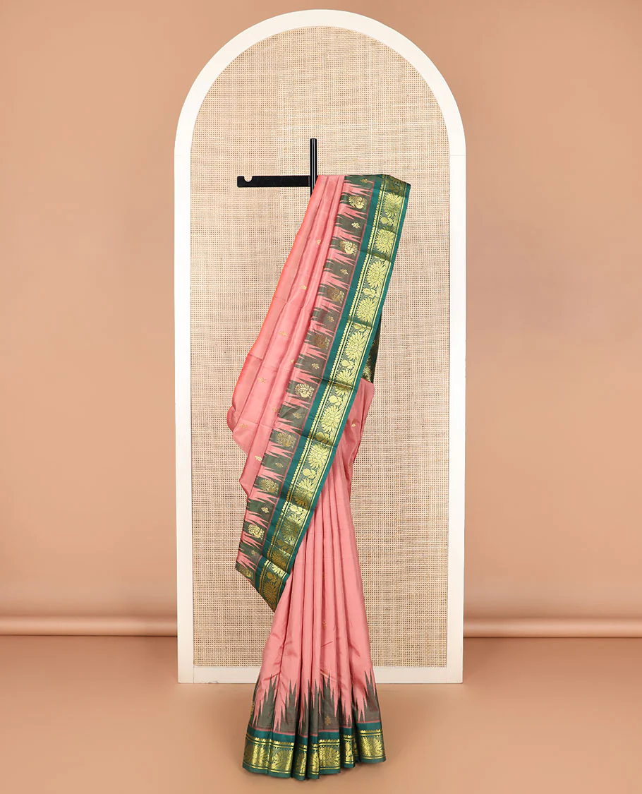 Pink zari buttas Kanchipuram silk saree, contrast thazampoo rekku border of salngai, and kamalam designs, and intricate pallu