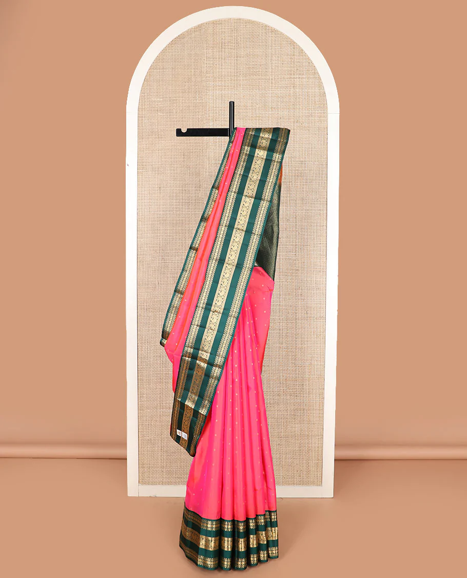 Pink zari buttas Vasundhara silk saree with contrast korvai varisai pettu border of rekku, muthu, banaras, rudraksham, neli, and mayil designs, and intricate pallu
