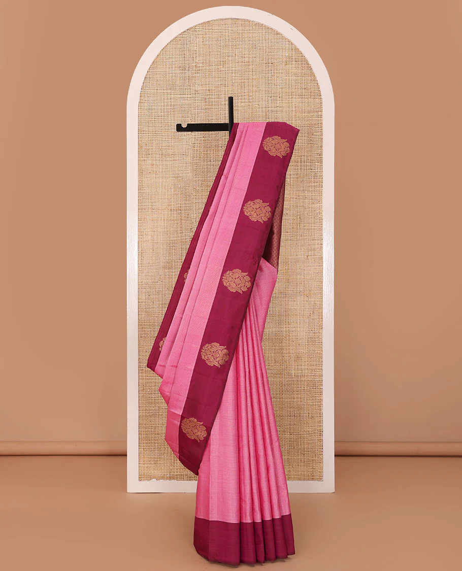 Pink zari woven Kanchipuram silk saree, contrast rettai mayil zari border, and jaal pallu