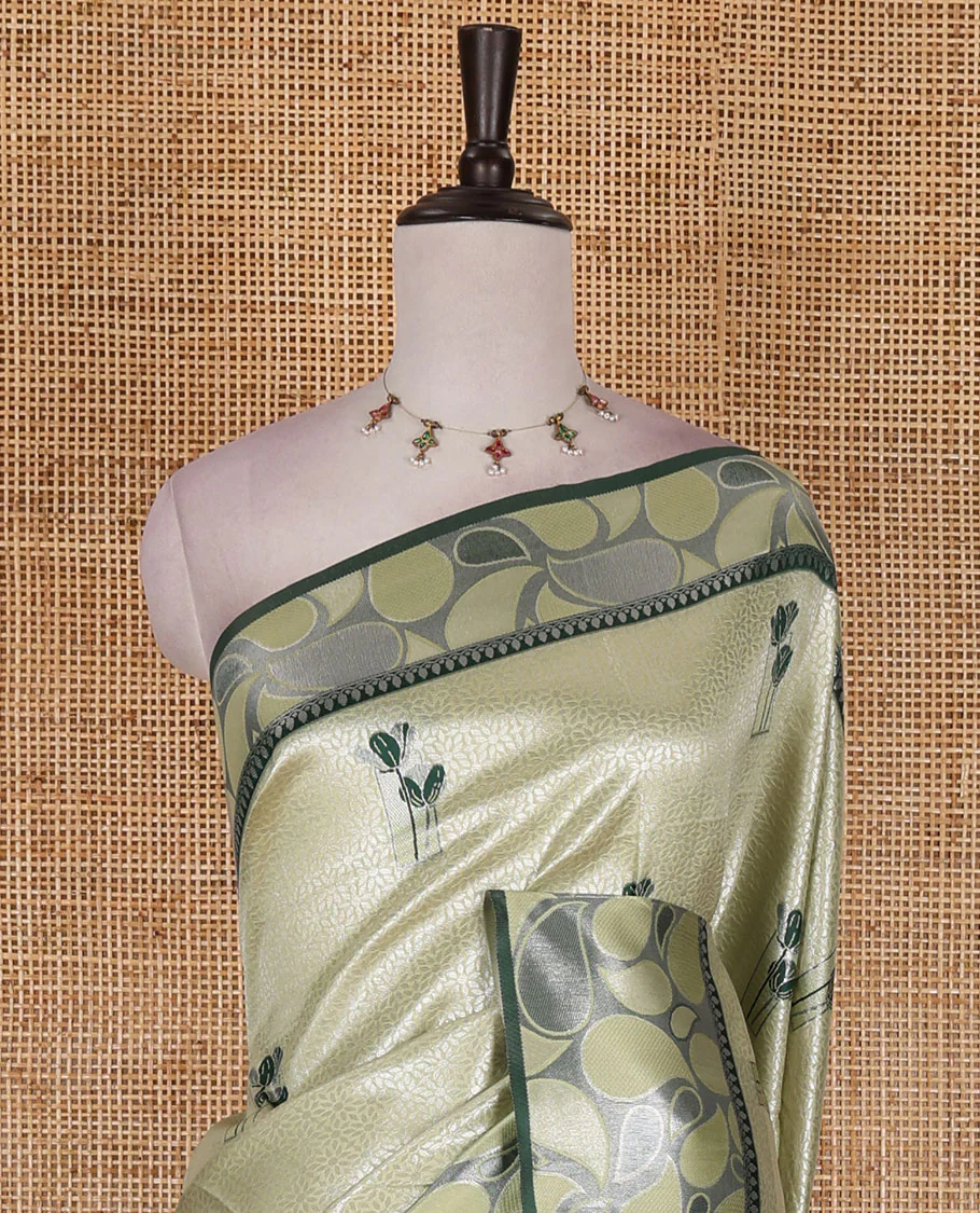 Pista green jacquard kanchi silk saree, contrast border, and pallu steeped with paisley motifs with contrast zari design blouse - Image 3