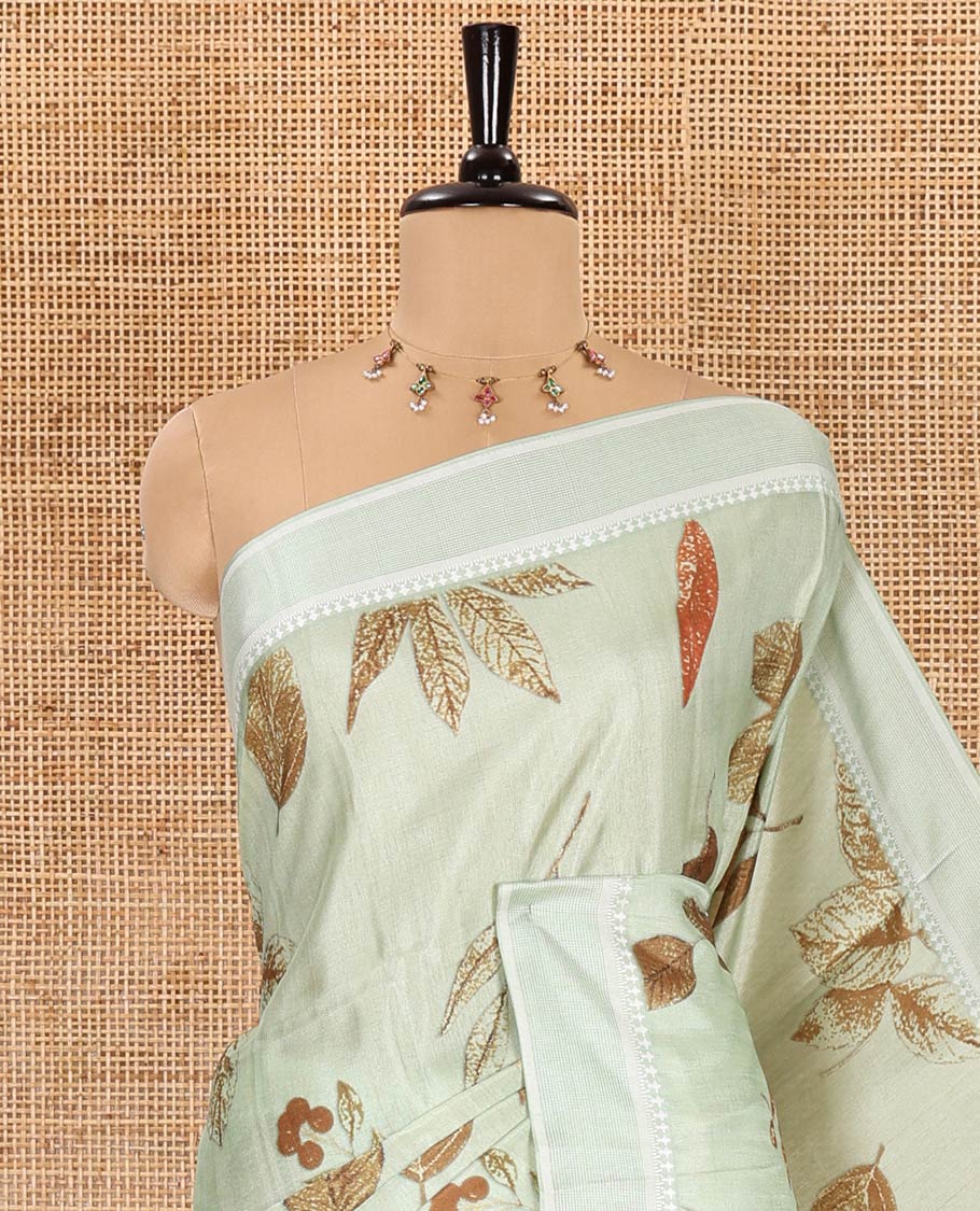 Pista green unique size and shaped leaf motifs printed fancy tussar saree, resham thread woven border, leaf motifs printed pallu, and a matching striped blouse - Image 2