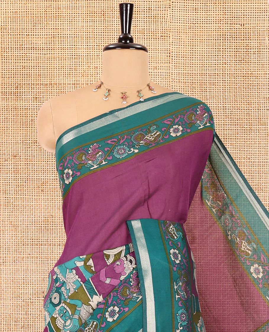 Purple human figurines printed muslin cotton saree, contrast floral-peacock printed border of piping work, kalamkari printed pallu, and a contrast blouse of flower motifs print - Image 2