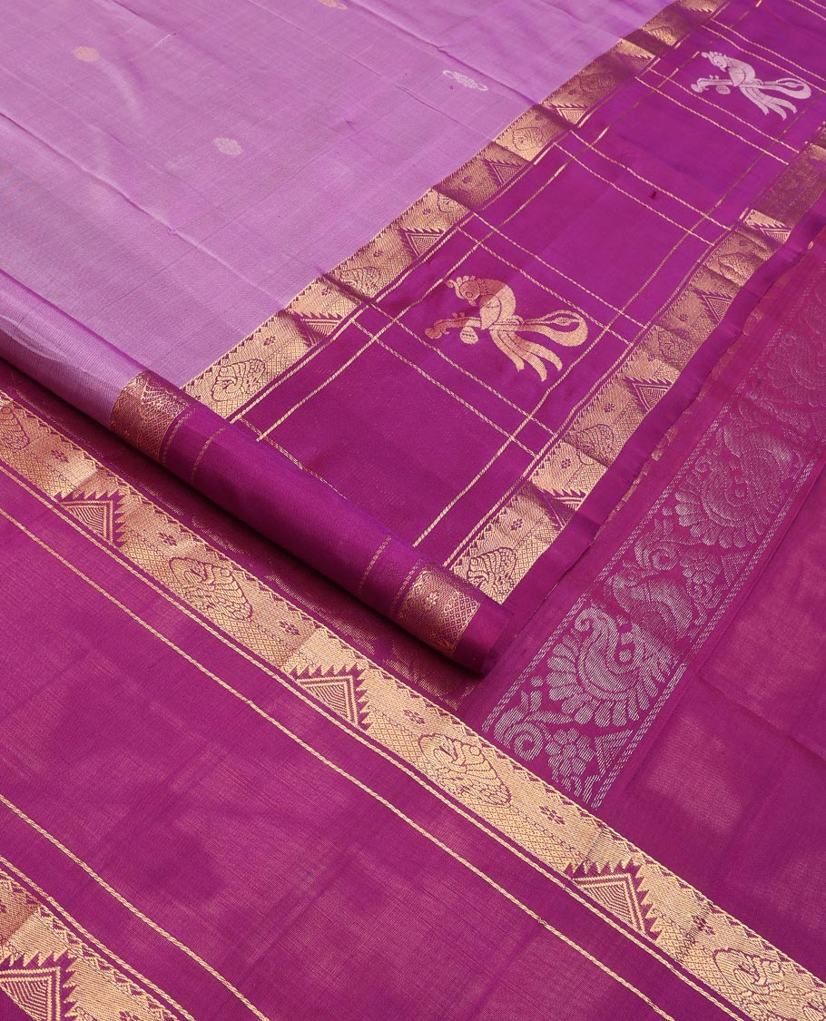 Purple Uppada Silk Saree Elevated with Floral Buttas, Captivating Contrast Border of Traditional Zari Motifs and Peacock Motifs, Pallu Depicting Floral Jaal Design, and Paired with a Contrast Zari-Bordered Blouse - Image 2