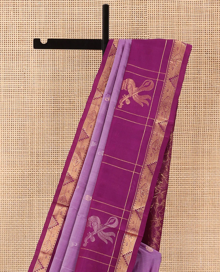 Purple Uppada Silk Saree Elevated with Floral Buttas, Captivating Contrast Border of Traditional Zari Motifs and Peacock Motifs, Pallu Depicting Floral Jaal Design, and Paired with a Contrast Zari-Bordered Blouse - Image 3