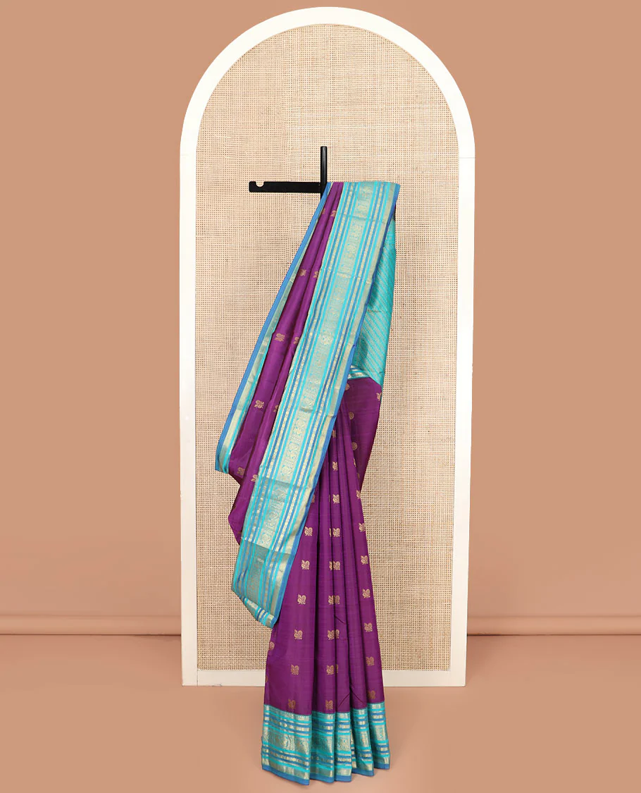 Purple Vasundhara Silk Saree Detailed with Mayil Chakram Buttas, Complemented by a Contrast Varisai Pettu Border of Rekku, Muthu, Kathir, Rudraksham, Mayil, and Mayil Kann Designs, Gleaming Pallu of Diagonal Stripes, and Paired with a Contrast Blouse