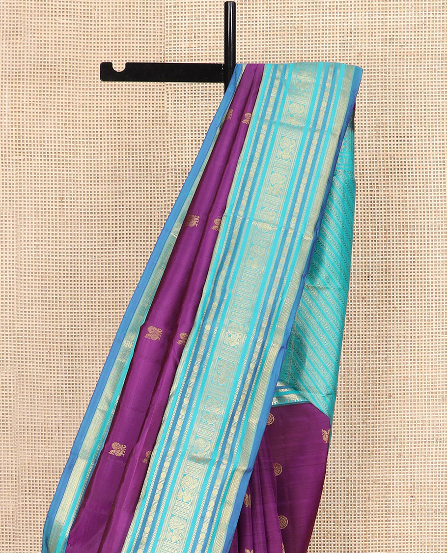 Purple Vasundhara Silk Saree Detailed with Mayil Chakram Buttas, Complemented by a Contrast Varisai Pettu Border of Rekku, Muthu, Kathir, Rudraksham, Mayil, and Mayil Kann Designs, Gleaming Pallu of Diagonal Stripes, and Paired with a Contrast Blouse - Image 3