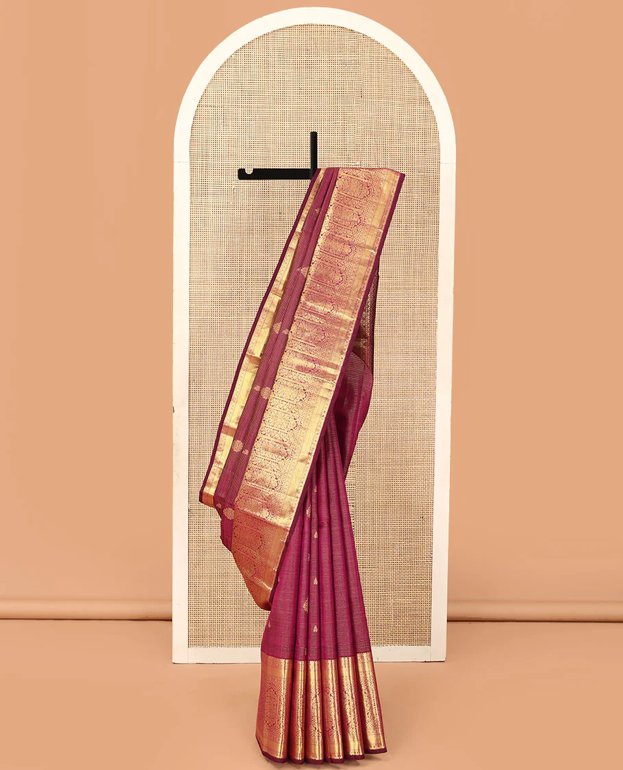 Purple zari stripes and buttas Kanchipuram silk saree, zari border of thilakam, poun, and MUghal-style floral designs, and pallu steeped with manga motifs
