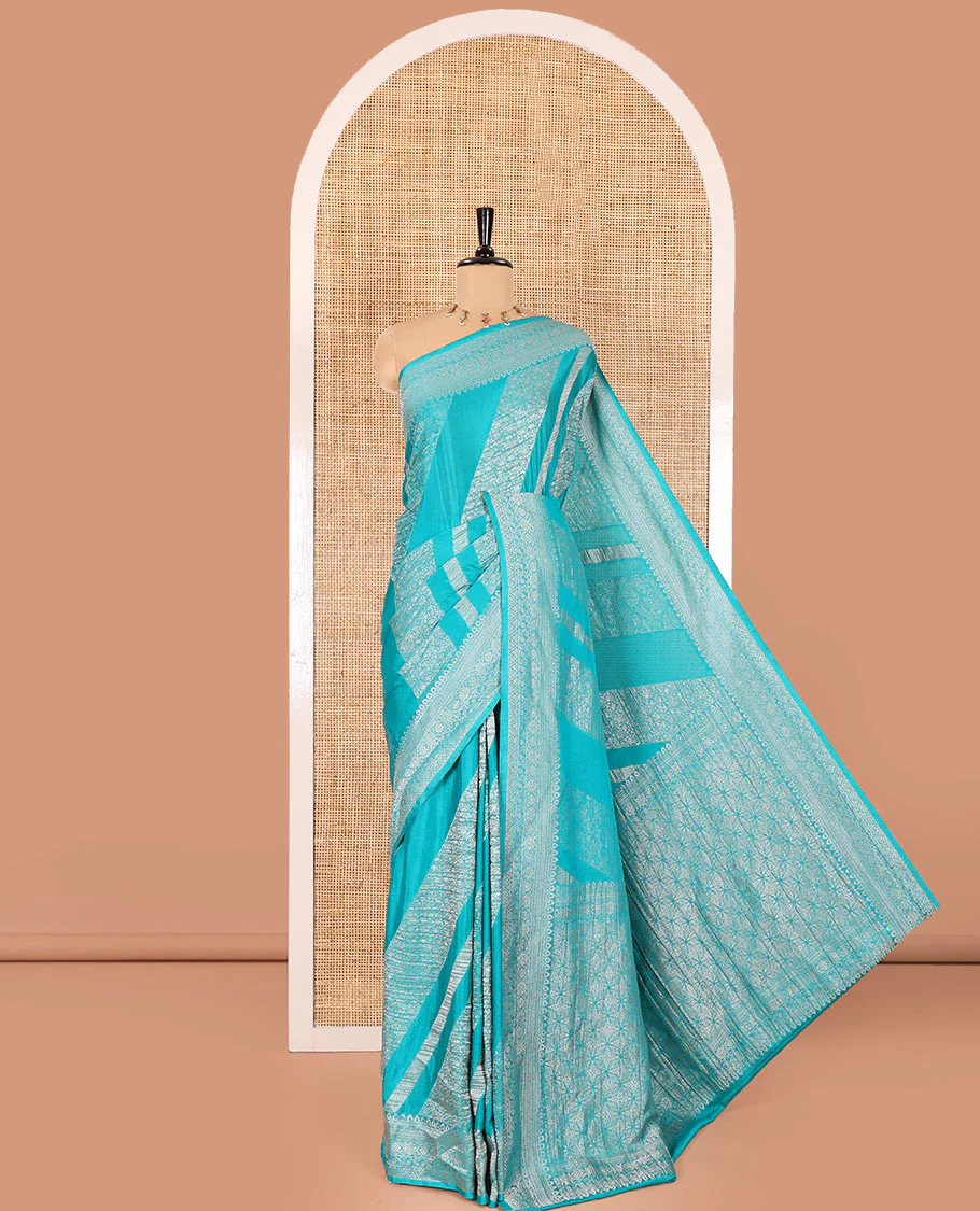 Rama green geometric and intricate designs zari woven fancy crepe saree, traditional zari border, floral-star gridded pallu, and a matching blouse