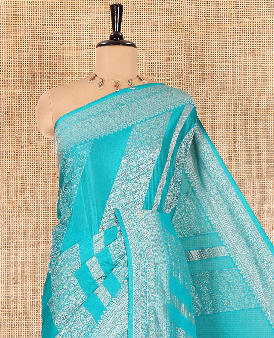 Rama green geometric and intricate designs zari woven fancy crepe saree, traditional zari border, floral-star gridded pallu, and a matching blouse - Image 2