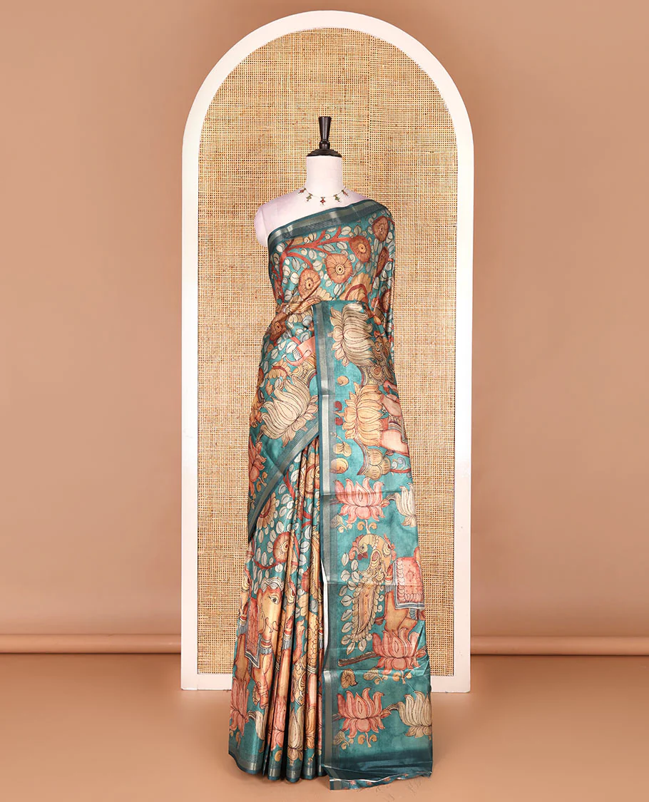 Rama green kalamkari elephant, peacock, and floral printed semi-tussar saree, zari piping border, kalamkari motifs printed pallu, and contrast printed blouse - Image 2