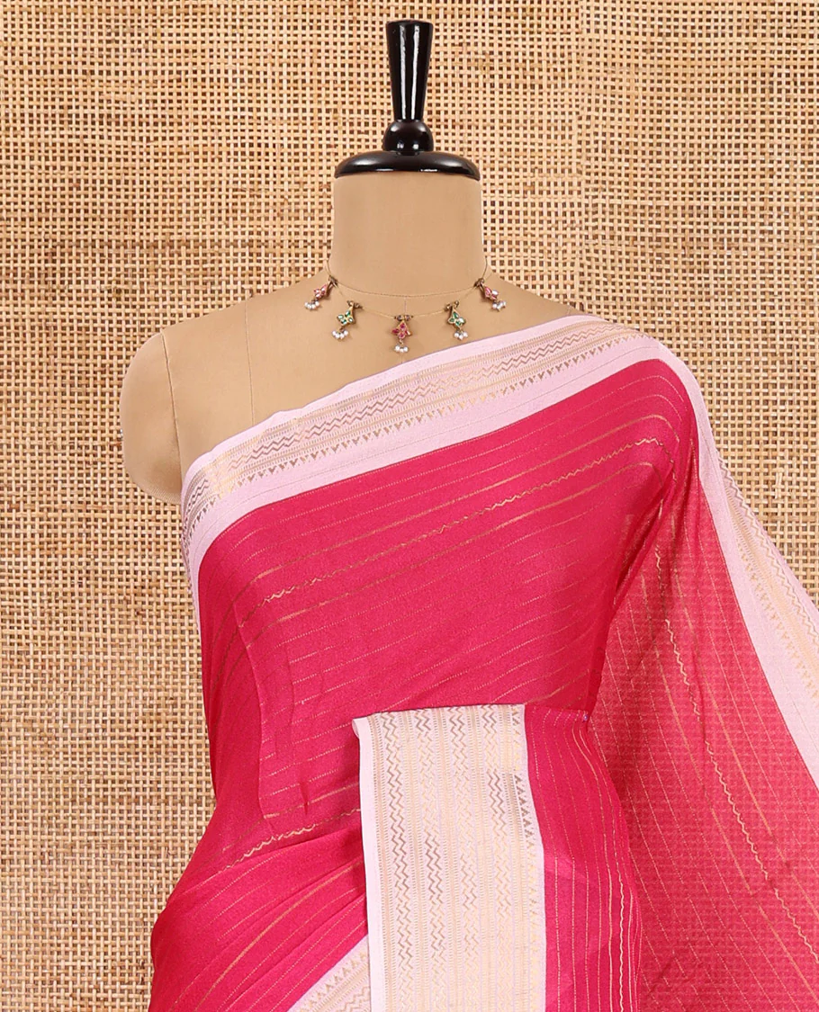 Rani pink horizontal striped moss chiffon saree, contrast traditional zari border, geometric patterns printed pallu, and a printed blouse - Image 2