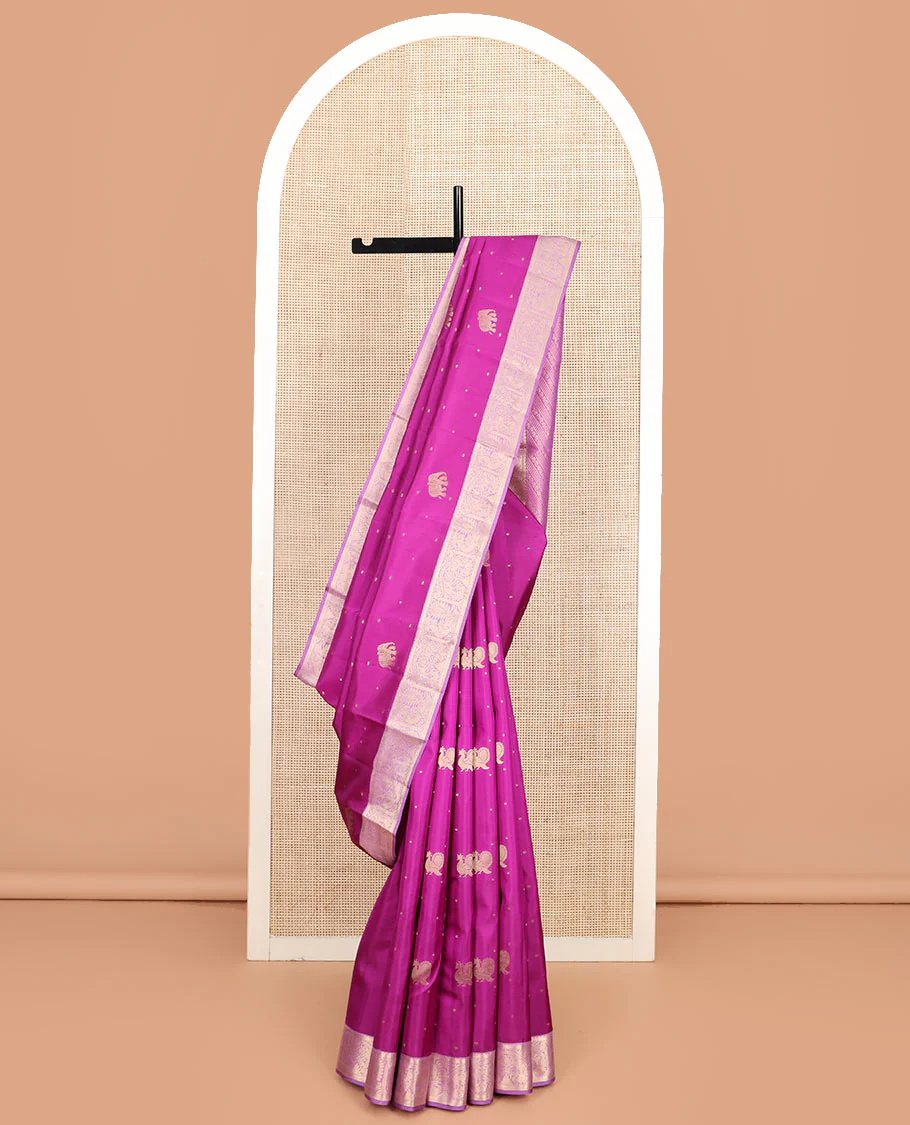Rani pink mayil and yaanai buttas Vasundhara silk saree, contrast border of rekku, kathir, mayil, and yaanai designs, and pallu of geometric patterns