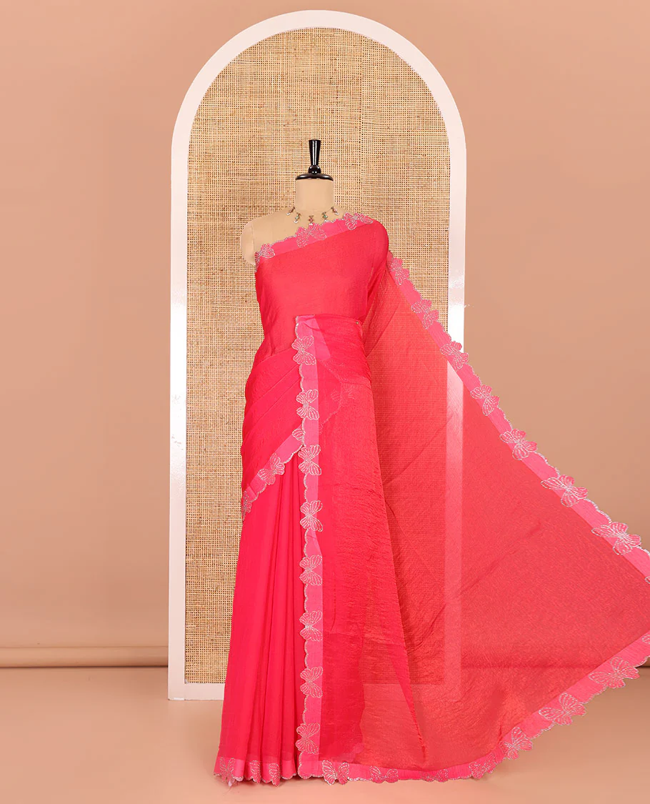 Rani pink plain fendy chiffon saree, scallop border of butterfly motifs in stone work, self-pallu, and a matching blouse