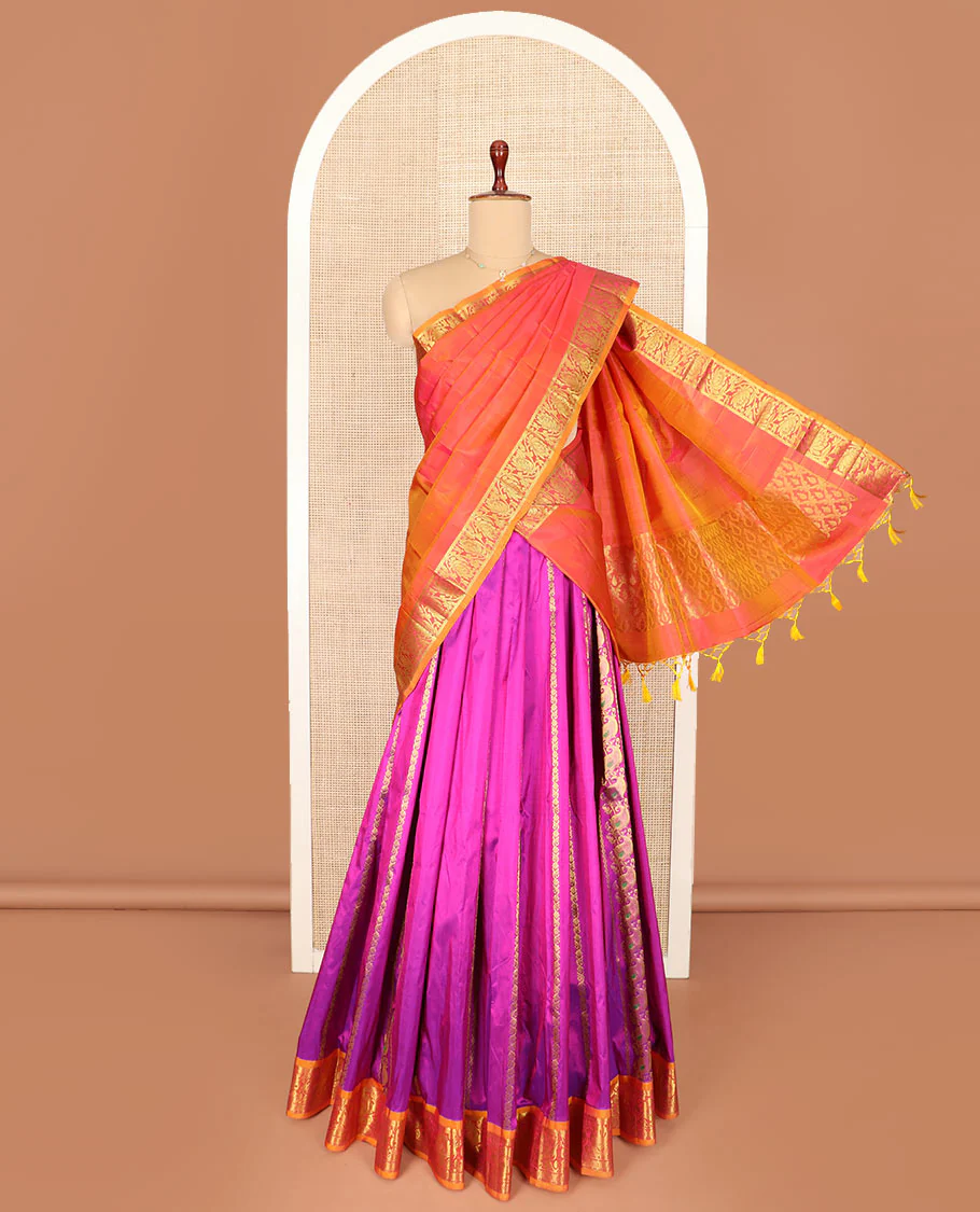 Rani Pink Pure Silk Half-Saree Embellished with Zari Designs on the Skirt, Complemented by a Contrast Zari-Design Border, Paired with a Contrast Blouse, and Featuring a Jaal-Designed Dhavani