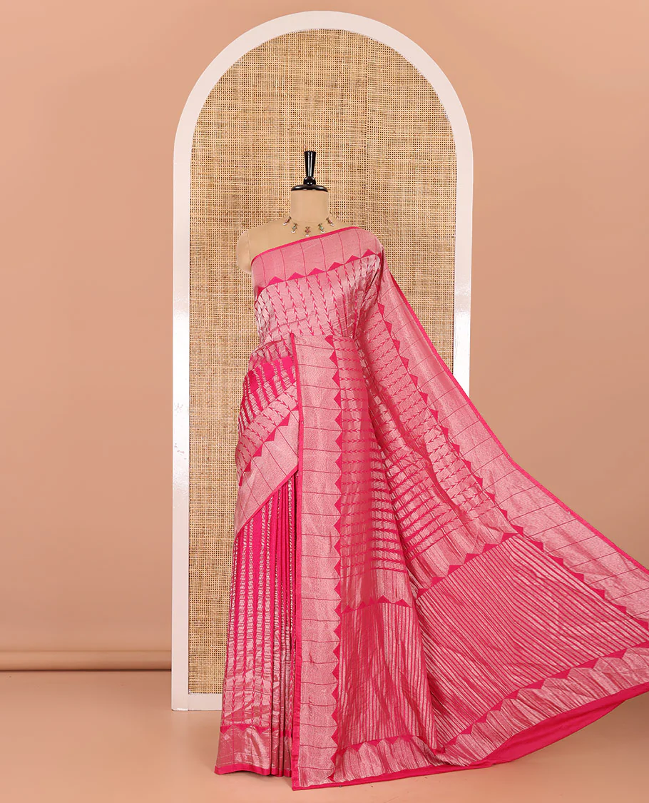 Rani pink zari geometric fancy crepe saree, temple zari border, zari striped pallu, and a matching buttas woven blouse