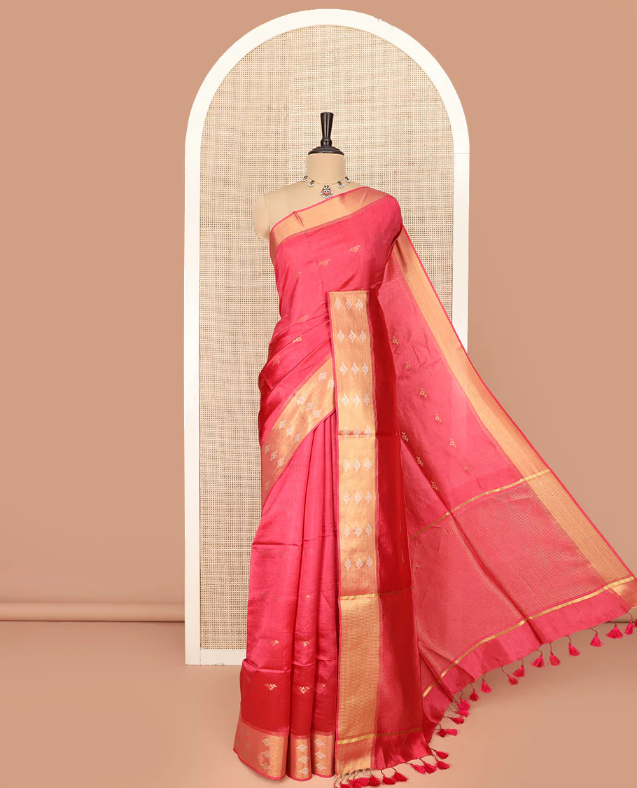 Red Banana Pith Saree Elegantly Framed with Zari Buttas, Artfully Detailed Border with Zari Designs, Gleaming Zari Stripes Woven Pallu, and Paired with a Matching Plain Blouse